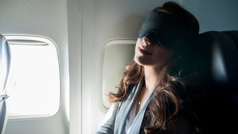 Airline passenger with eye mask