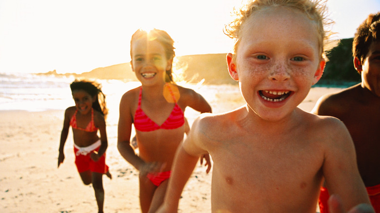 Kids running on the beach 