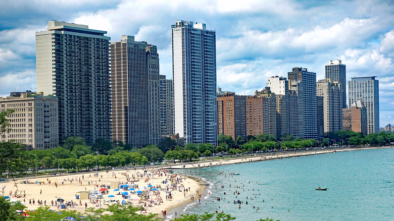 busy beach with high-rise buildings