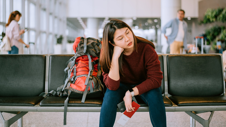 upset person waiting in airport