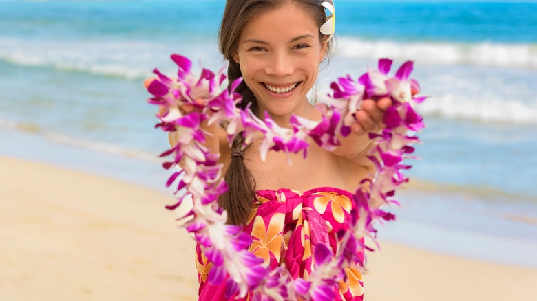 Woman offering a Hawaiian lei