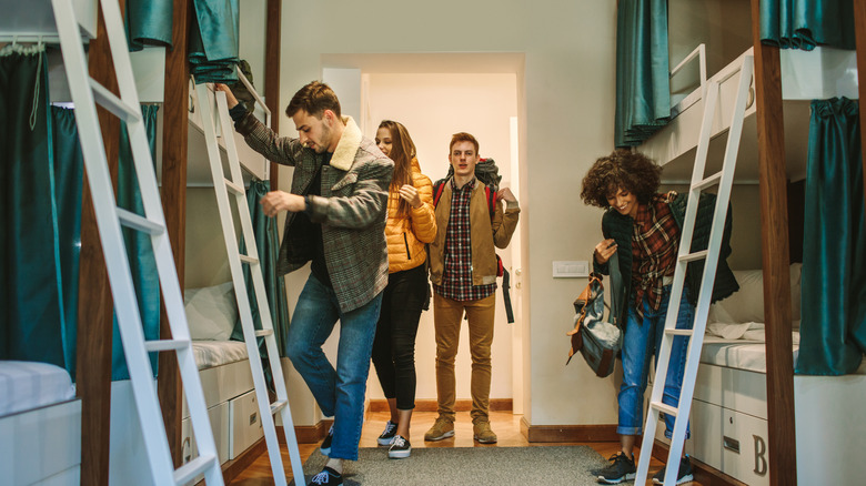 Travelers settling into a hostel