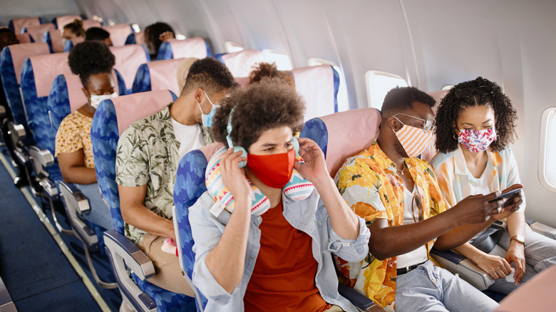 Passengers wearing masks on fiight