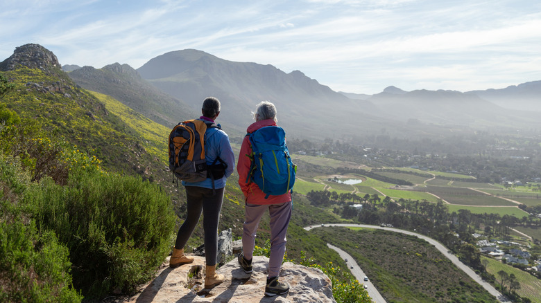 two hikers looking out at a view