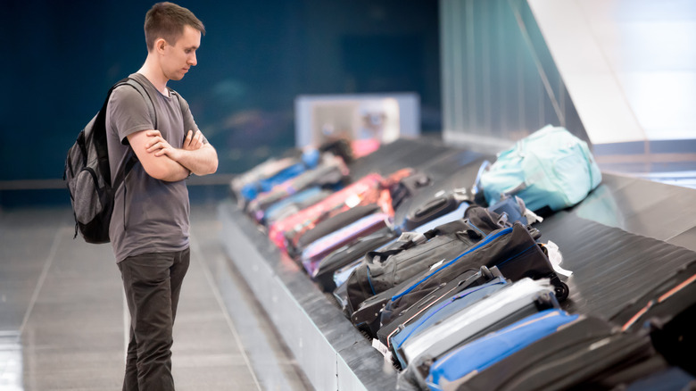 Man waiting for his luggage