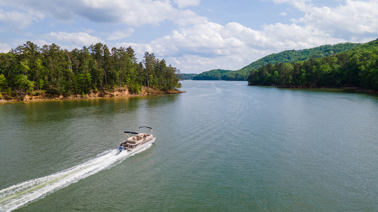 Pontoon boat sailing on empty Lake Lanier