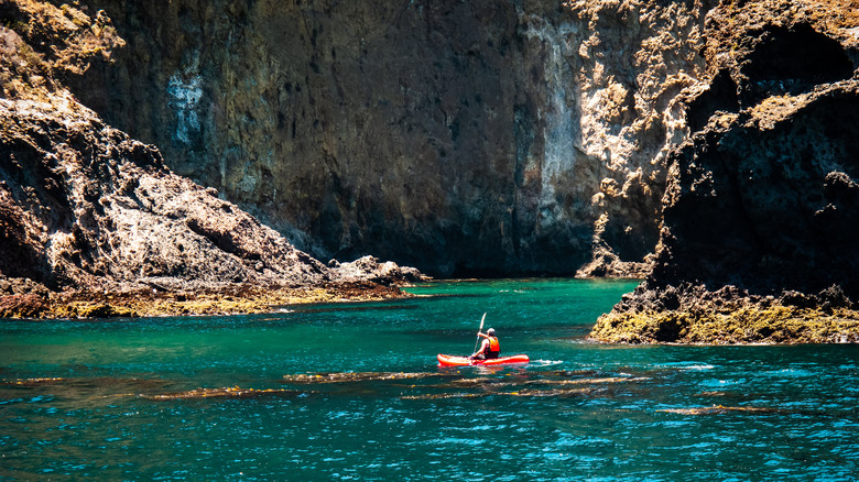 A sea kayaker among the sea caves at Channel Islands National Park.