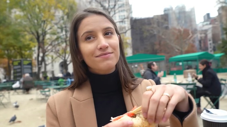 woman eating bagel