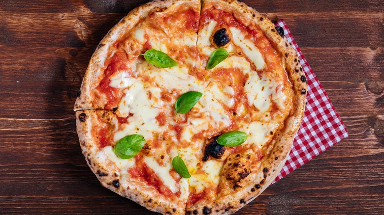 Traditional pizza on table