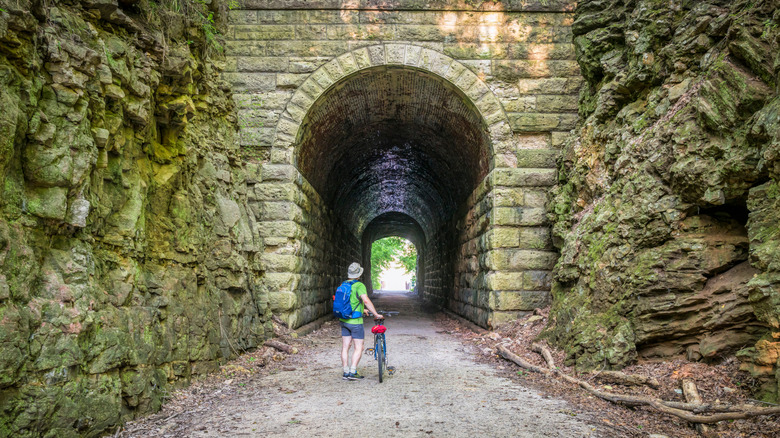 cyclist entering railway tunnel along the Katy Trail