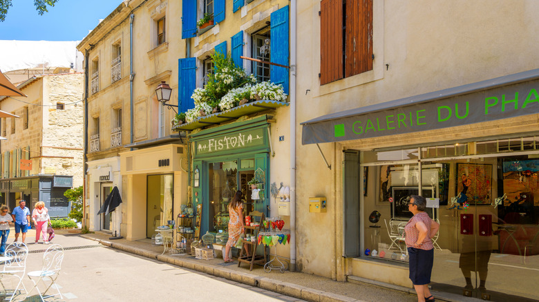 colorful storefronts, people walking
