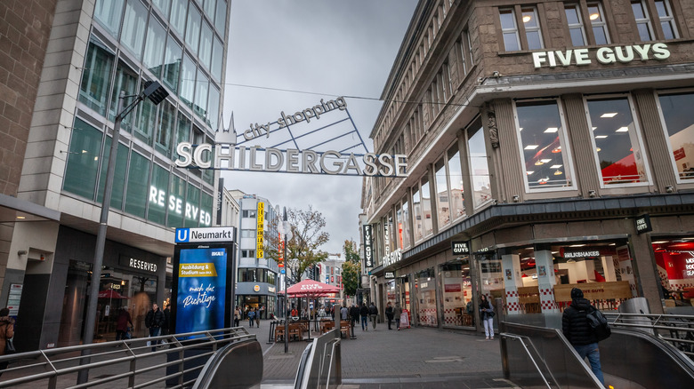 modern buildings, store signs, subway entrance