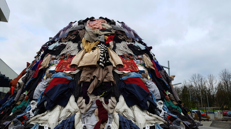 pile of clothes in garbage dump