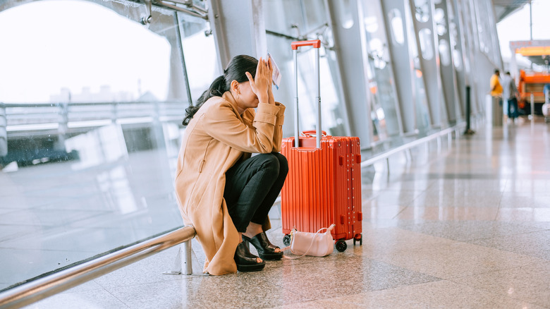 stressed traveler at airport