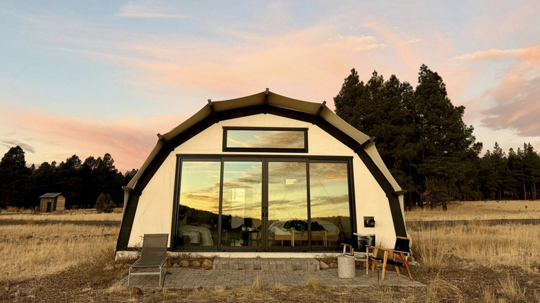 a gorgeous shot of Backland Glamping tents and surrounding scenery