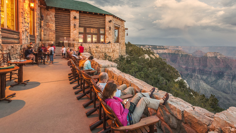 visitors relaxing on the porch of Grand Canyon Lodge North Rim