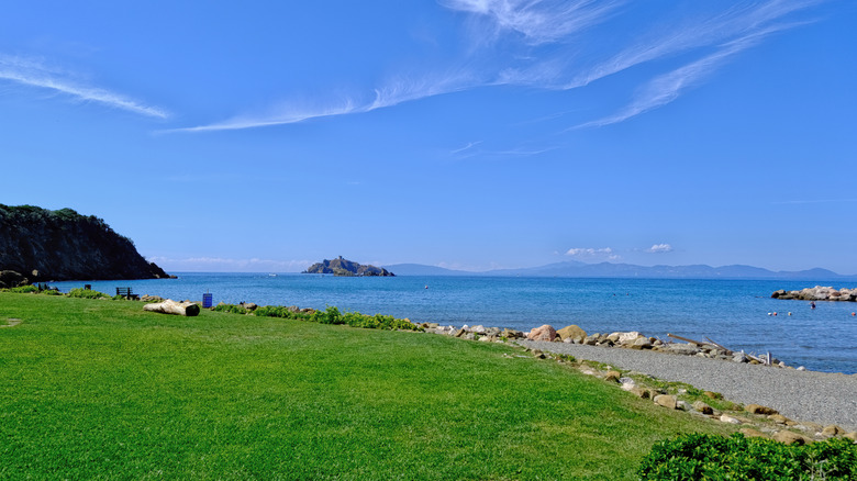 A path along the sea on the Punta Ala coast with view of Sparviero and Elba Island