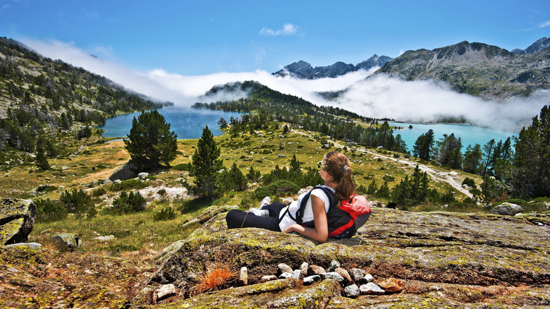 A woman looks out at the Col et Pic de Madaméte pass