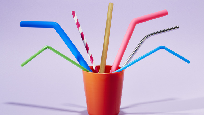 a series of straws in a cup