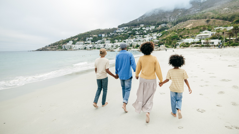 family walking on a beach