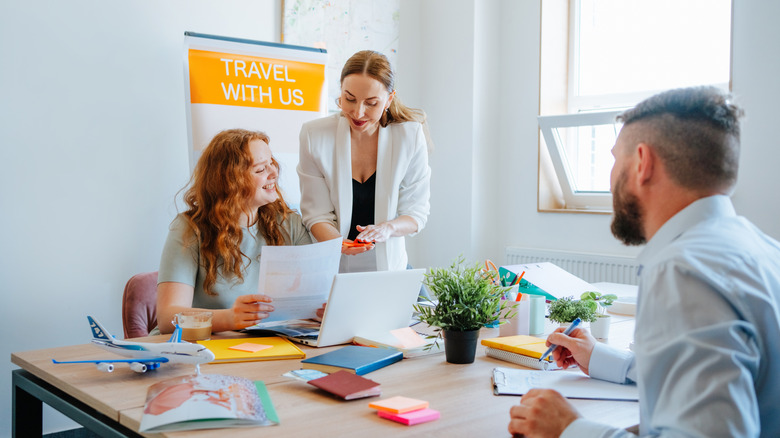people in a travel agent's office