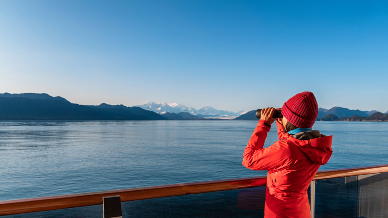 looking at Glacier Bay through binoculars