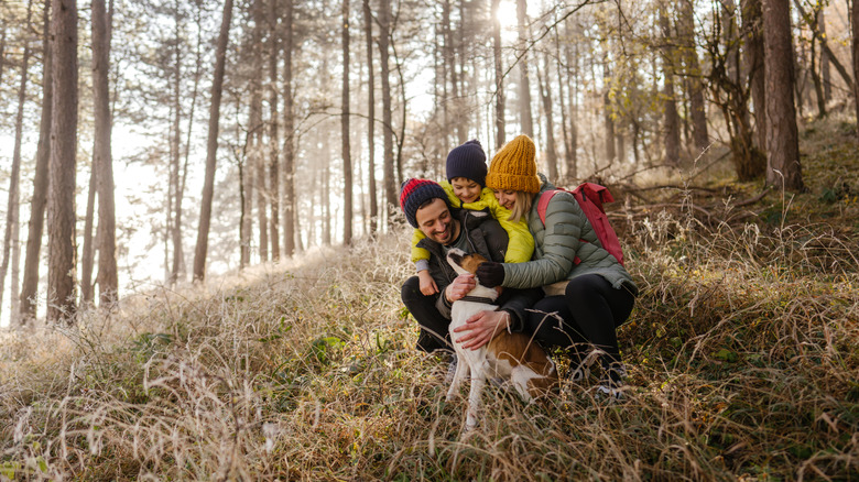 Family hiking with dog