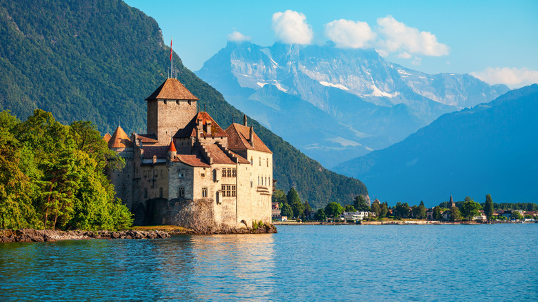 Chillon Castle or Chateau de Chillon as seen from across  Lake Geneva in Switzerland.