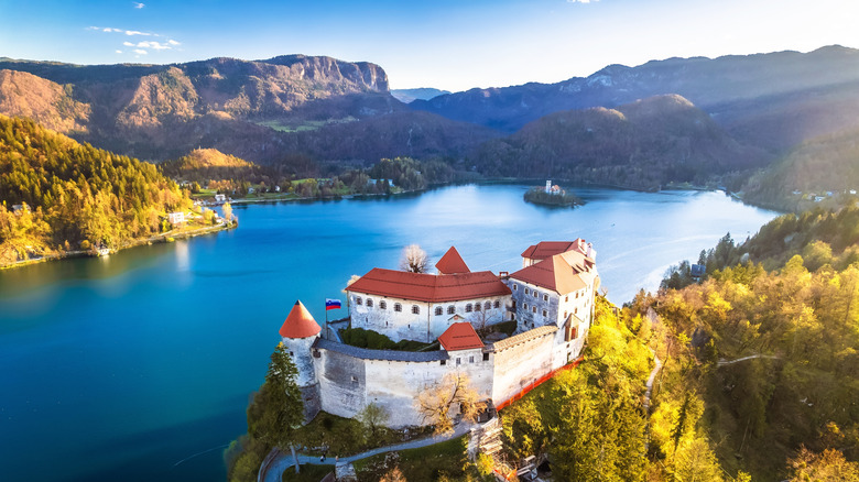 Bled castle on the rock above scenic lake aerial view, mountain landscape of Slovenia