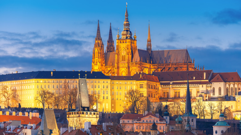 Prague Castle and Mala Strana seen from a distance during twilight.