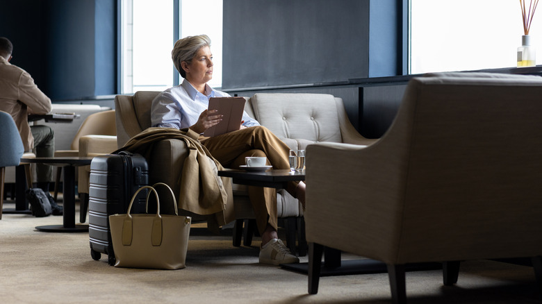 luxury traveler in airport lounge