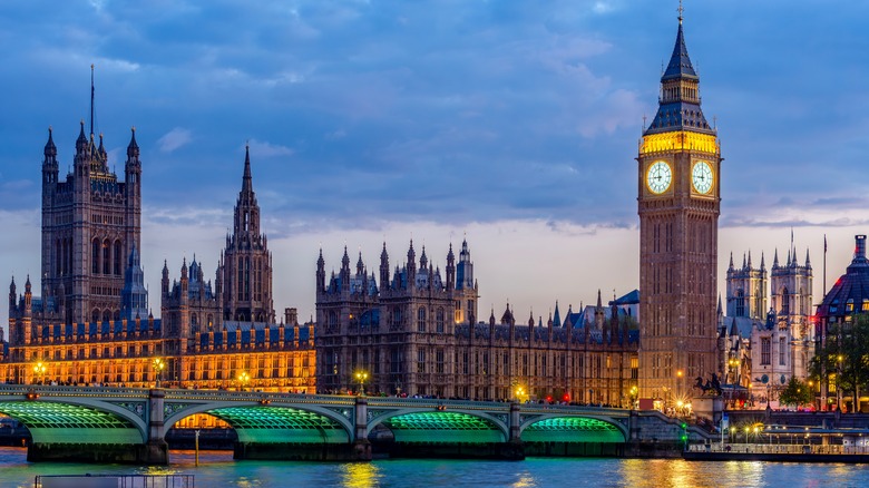 Houses of Parliament with Big Ben tower and Westminster bridge at sunset, London, UK