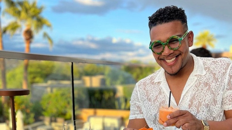 man sitting at table eating