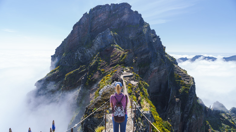 Hiker on the Pico Ruivo trail Stairway to Heaven Madeira Portugal.