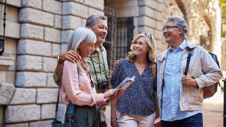 Tourists reading guidebook