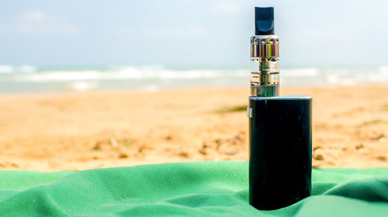 Vape standing on a beach