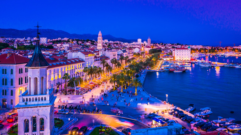 A breathtaking nighttime view of the illuminated Riva promenade in Split, Croatia.