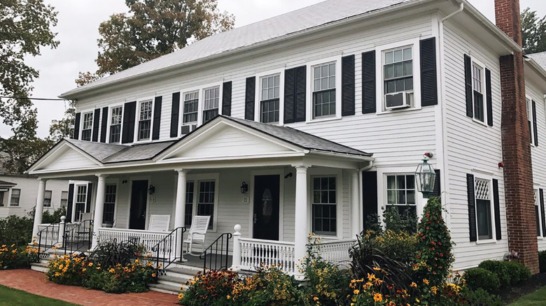 White-shingled exterior of the Publick House Historic Inn