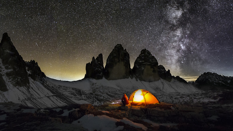 A camper wearing a headlamp 