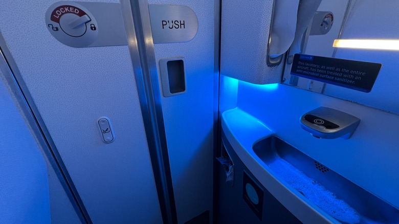 airplane lavatory sink blue lighting