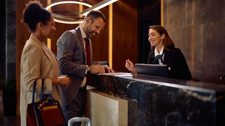 Couple checking in to hotel