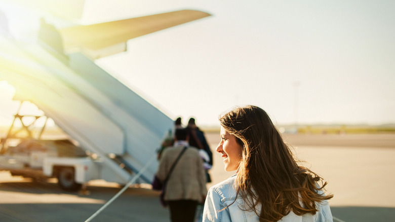 Woman near airplane