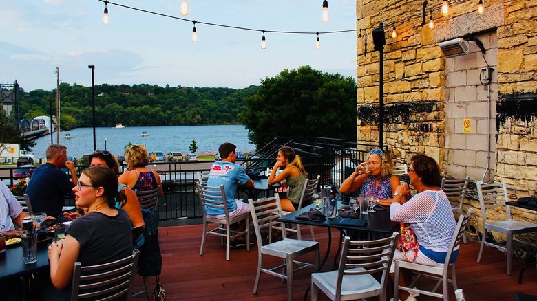 Customers enjoy the view from the deck of the Brick & Bourbon, Stillwater, Minnesota