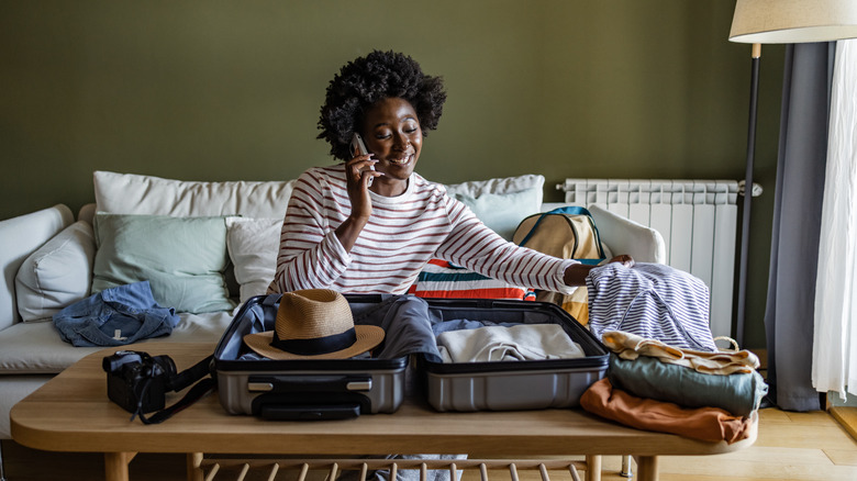 woman packing a suitcase