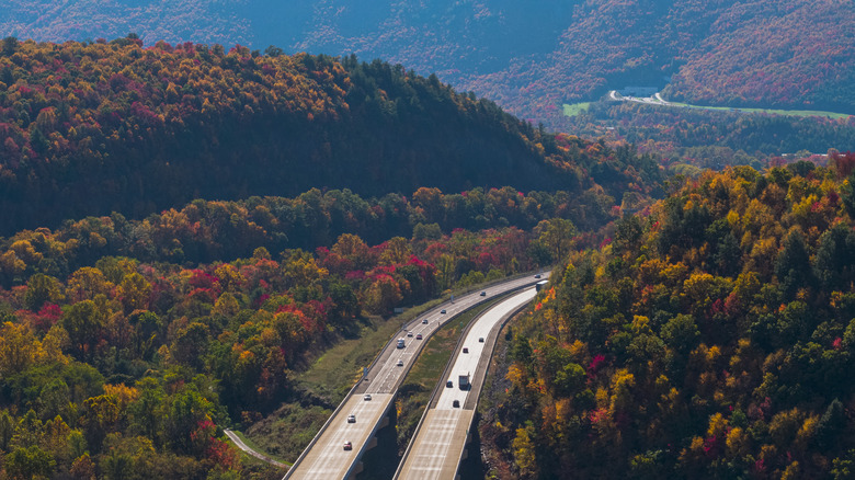 High bridge running through forested hills at the Pennsylvania Turnpike on the sunny spring day