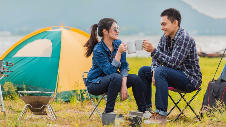 couple sitting outside their tent