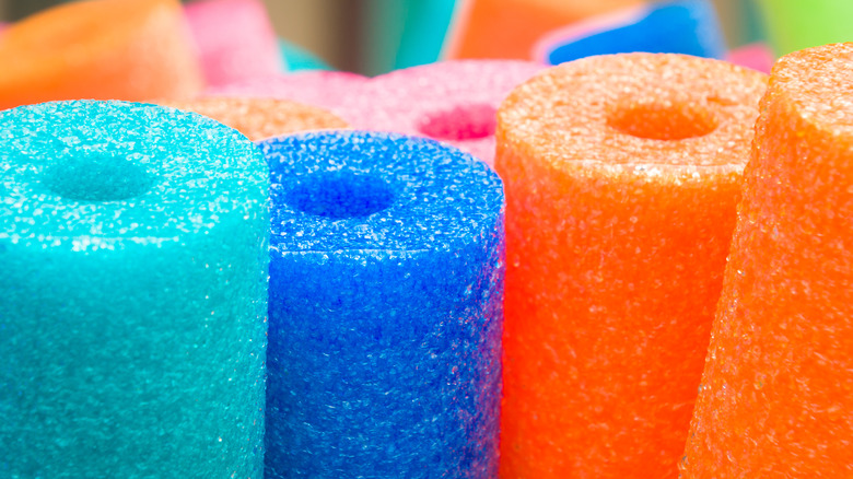 Several colorful pool noodles