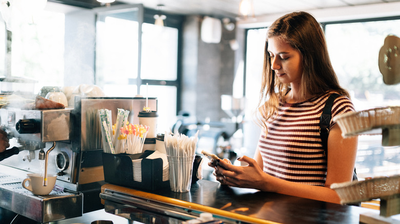 Woman waiting to order coffee