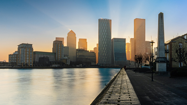 Sunrise from behind skyscrapers at Canary Wharf in London