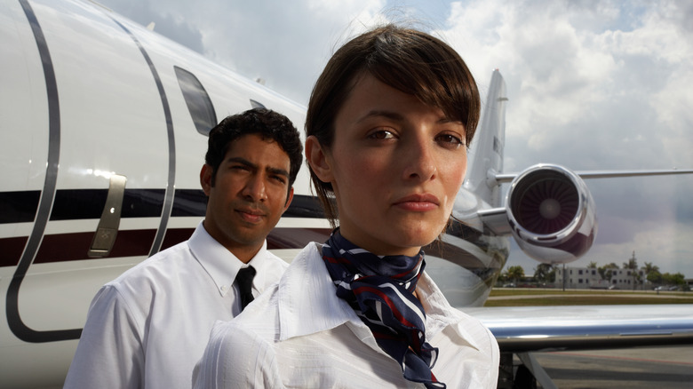 Male and female flight attendants